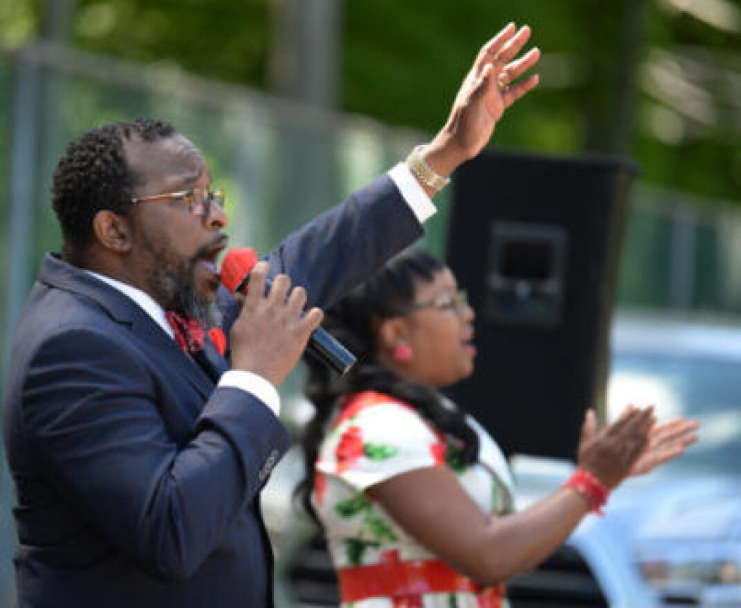 The Rev. Ronald Holmes leads a drive-up church service at Gethsemane Missionary Baptist Church in Bloomfield.